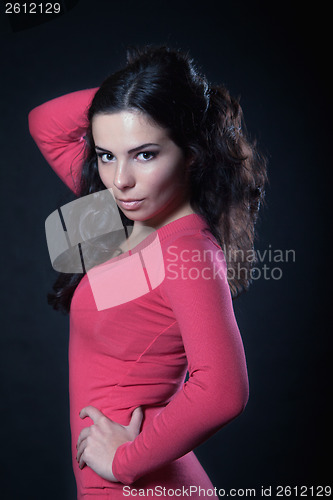 Image of Young woman in pink dress