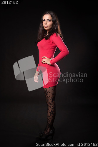 Image of Young woman in pink dress
