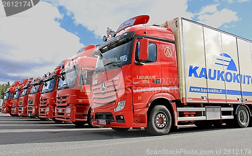 Image of Fleet of Red Long Haulage Trucks