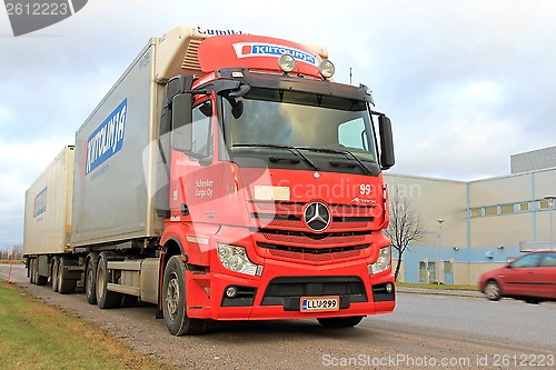 Image of Red Mercedes-Benz Truck and Trailer on the Road