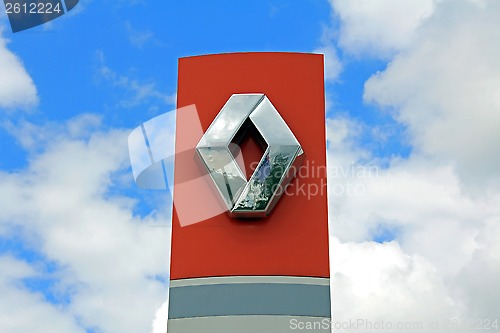 Image of Sign Renault against Blue Sky with Clouds