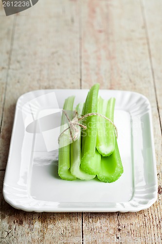 Image of fresh green celery stems in plate