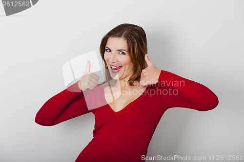 Image of Happy woman with thumbs up