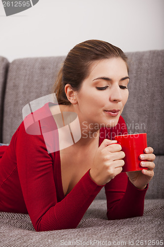 Image of Woman relaxing with a coffee