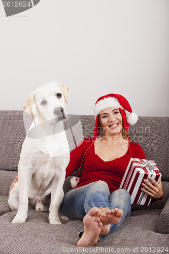 Image of Woman with her dog on Christmas Day