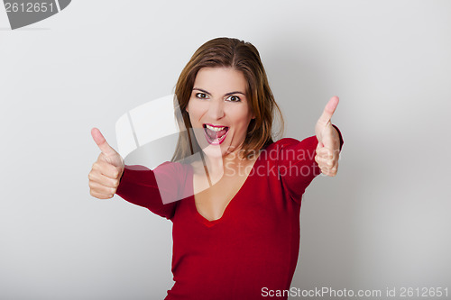 Image of Happy woman with thumbs up