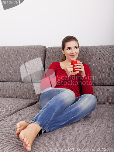 Image of Woman relaxing with a coffee