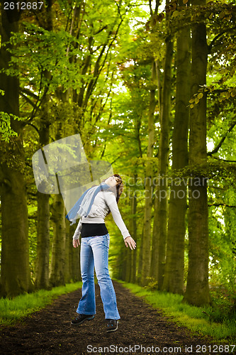 Image of Girl jumping in the nature