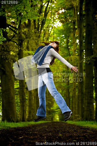 Image of Girl jumping in the nature