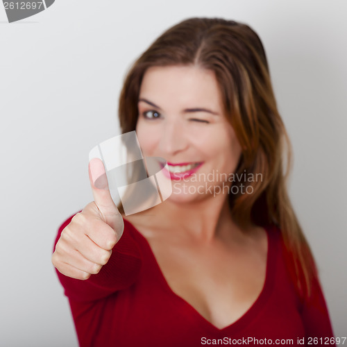 Image of Happy woman with thumbs up