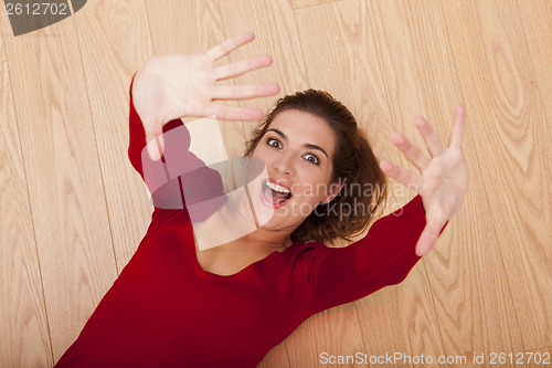 Image of Woman lying on the floor