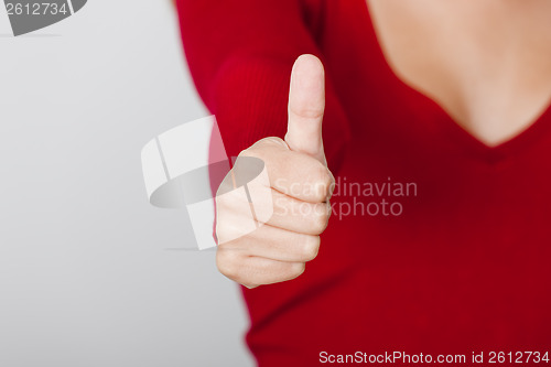 Image of Female hand with thumbs up