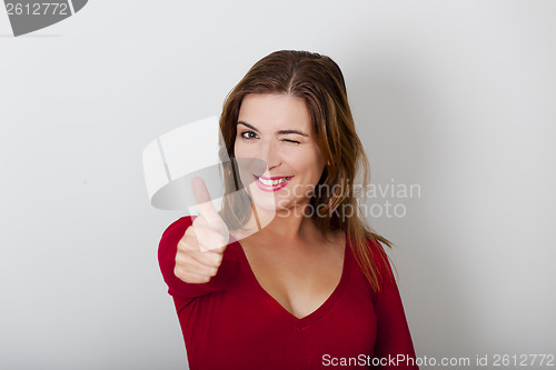 Image of Happy woman with thumbs up