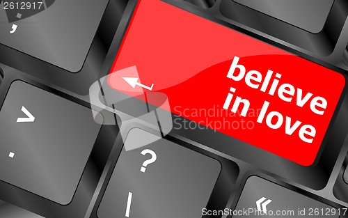 Image of keyboard key with believe in love text and arrow