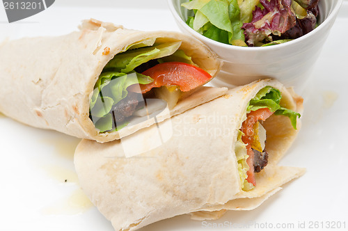 Image of kafta shawarma chicken pita wrap roll sandwich