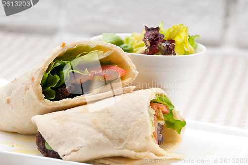 Image of kafta shawarma chicken pita wrap roll sandwich