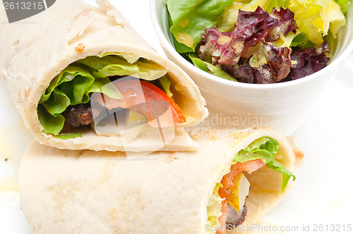 Image of kafta shawarma chicken pita wrap roll sandwich