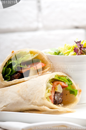 Image of kafta shawarma chicken pita wrap roll sandwich