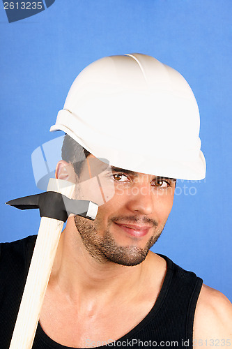 Image of Handsome worker with hard hat and hammer