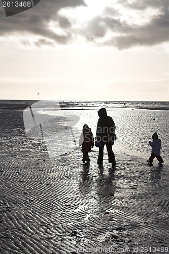 Image of People looking for amber at the beach of the Island of Fanoe in 