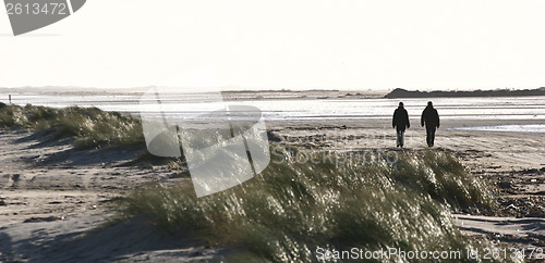 Image of People walking on the beach Island of Fanoe in Denmark