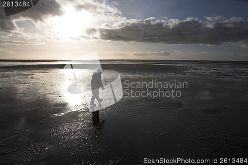 Image of People looking for amber at the beach of the Island of Fanoe in 