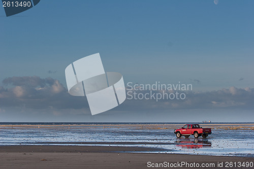 Image of Red car on the beach Island of Fanoe in Denmark