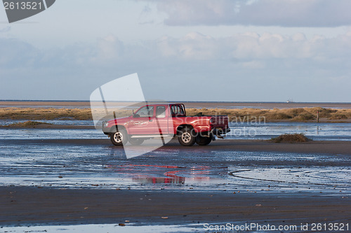 Image of Red car on the beach Island of Fanoe in Denmark