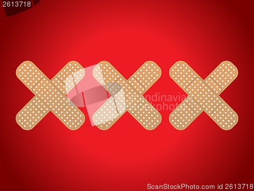 Image of XXX shaped plasters on red background