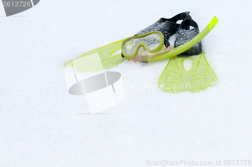 Image of Snorkel, mask and flippers lying on the snow