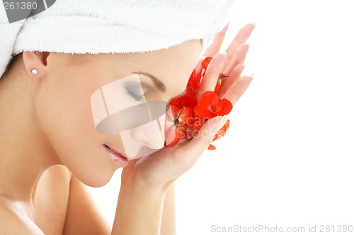 Image of happy woman with red flower petals