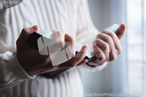 Image of Man reading. Book in his hands.