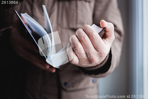 Image of Man reading. Book in his hands.
