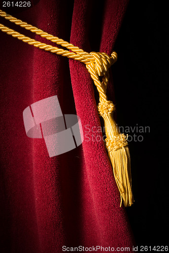 Image of Red velvet curtain with tassel