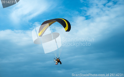 Image of Paragliding fly on blue sky