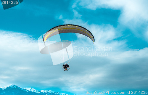 Image of Paragliding fly on blue sky