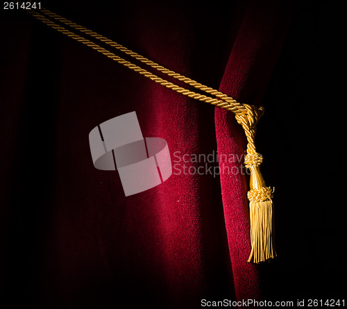 Image of Red velvet curtain with tassel