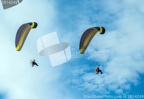Image of Paragliding fly on blue sky