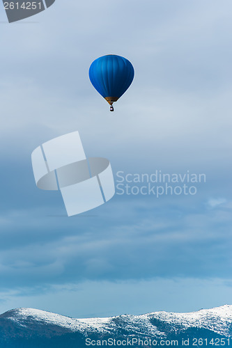 Image of Blue balloon in the blue sky