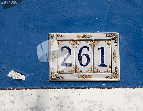 Image of decorated ceramics house number sign