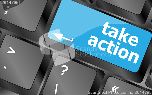 Image of Take action red key on a computer keyboard, business concept