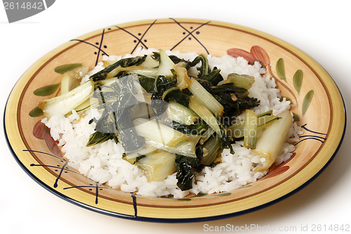 Image of Sauteed bok choi on a bed of jasmin rice side view