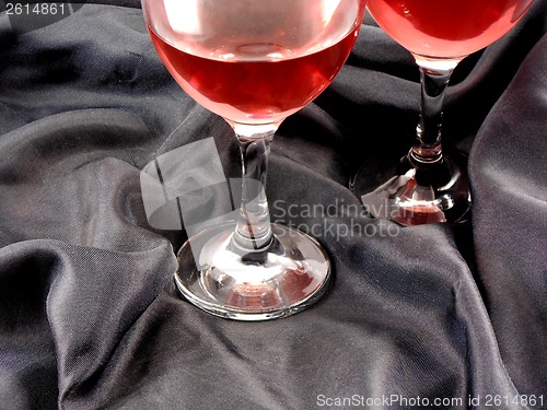 Image of Red wine in glass on black background close up