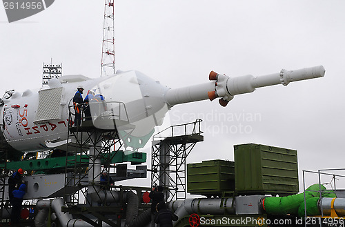 Image of Technicians on Soyuz Spacecraft