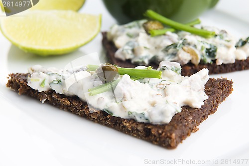 Image of sandwiches with dark bread, herrings, mushrooms, pepper