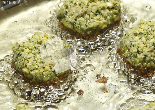 Image of Falafel balls frying in oil