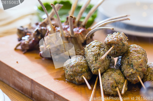 Image of Roasted lamb meat on the big table