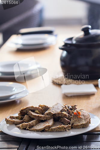 Image of Roasted meat slices on the table