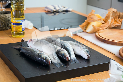 Image of Some fishes on the kitchen's table