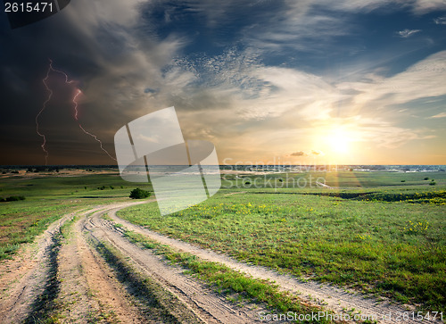 Image of Storm over the road in field